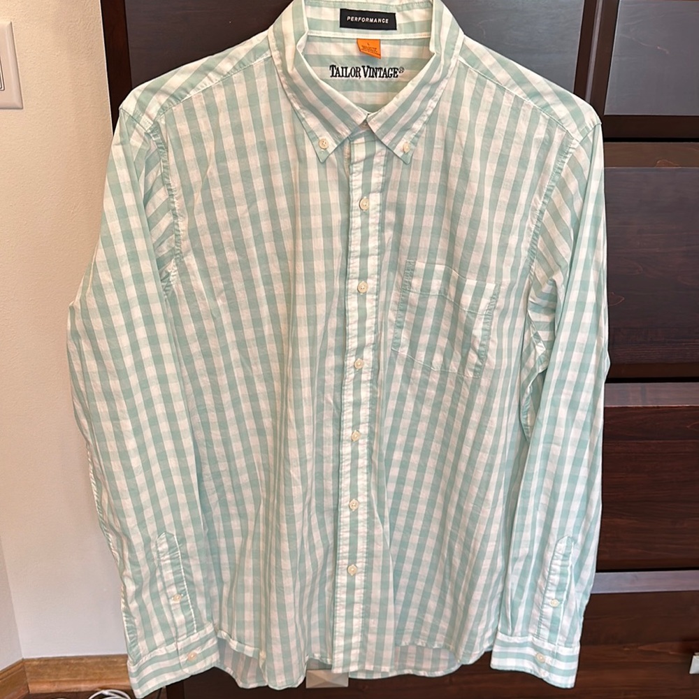Brand new! Never worn! Long sleeve light green plaid button down shirt.